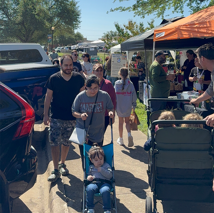 Shoppers browse local vendors at the Small Business Saturday Market in downtown Pflugerville.