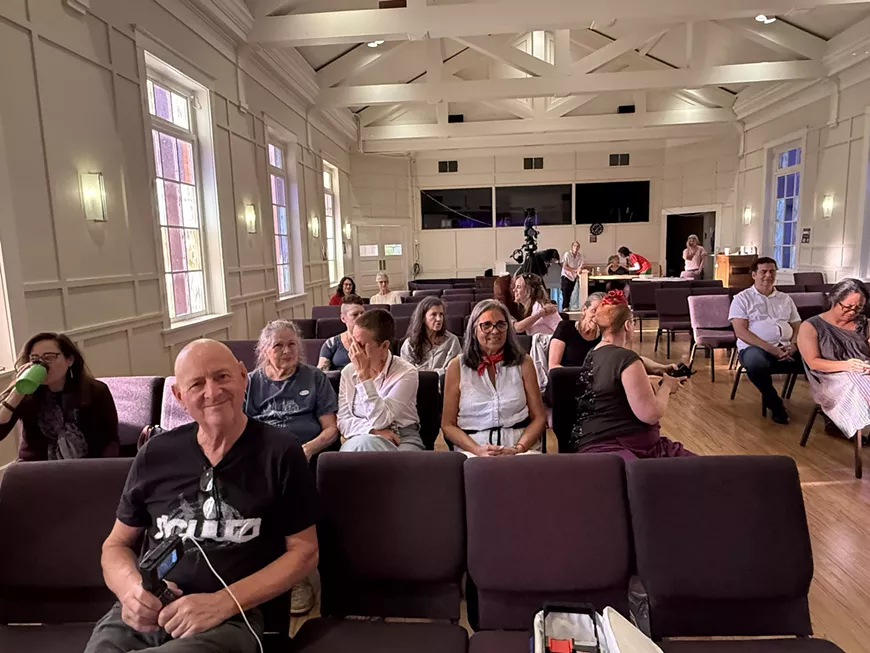 The audience gathers