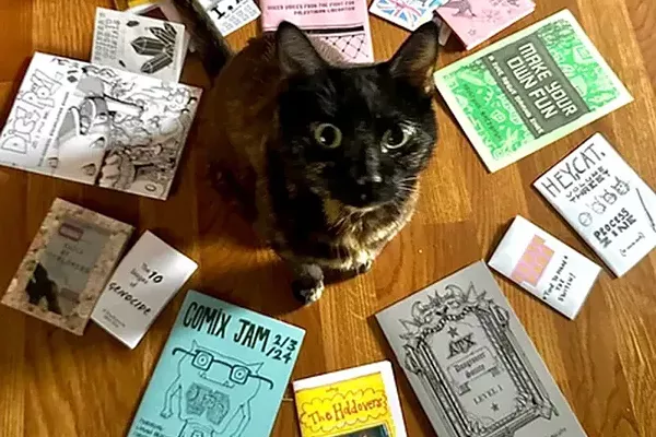Best Zine Library With a Friendly Cat